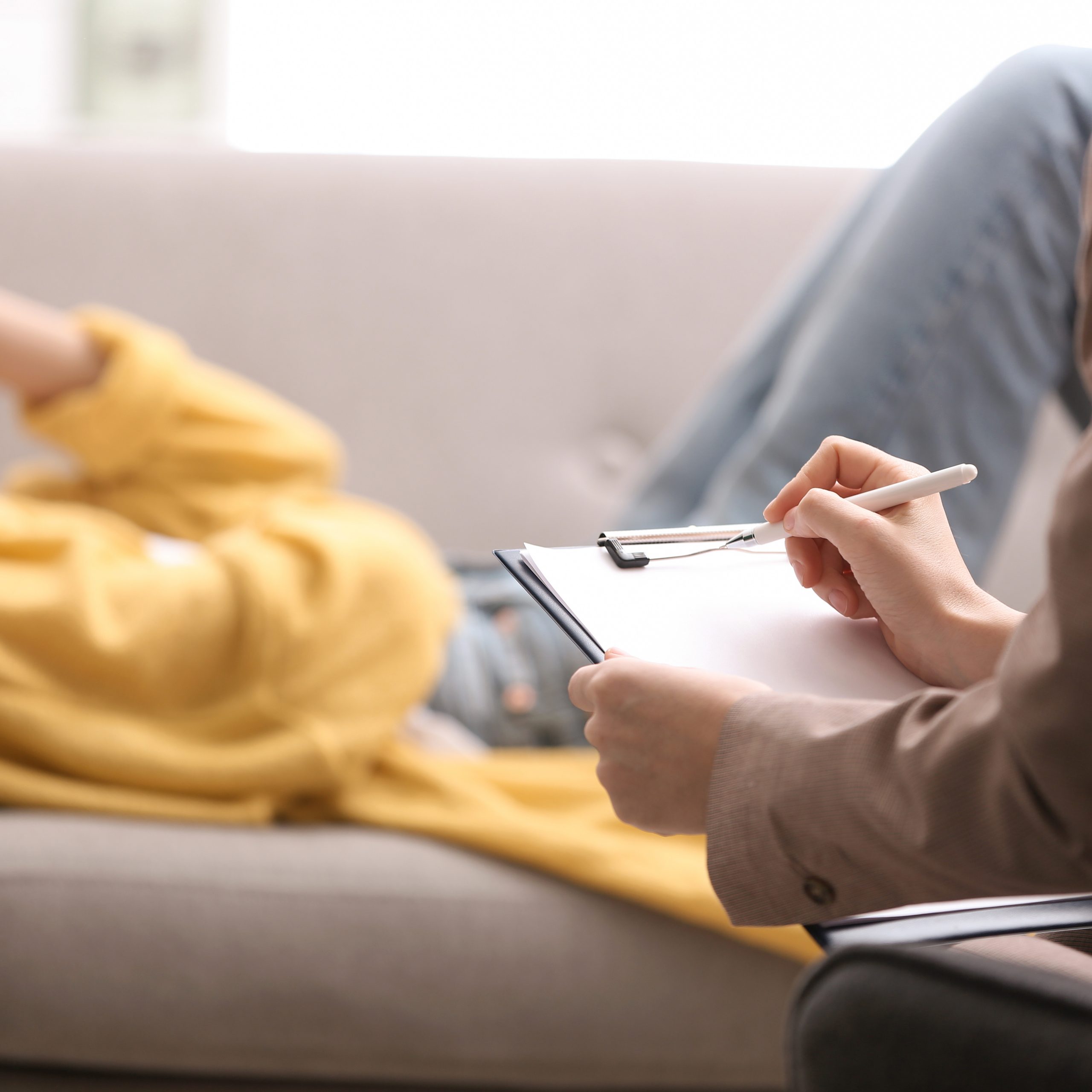 Psychotherapist Working With Woman In Office, Closeup